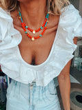 Zomers turquoise en oranje kralenketting